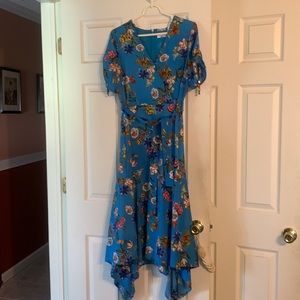 Calvin Klein dress. V neck. Wrap style with Handkerchief/ high low on sides.